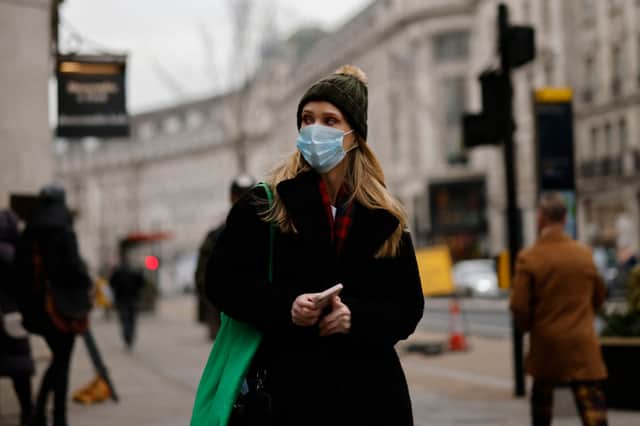 A woman wears a facemask in London in January 2022. Credit: Getty