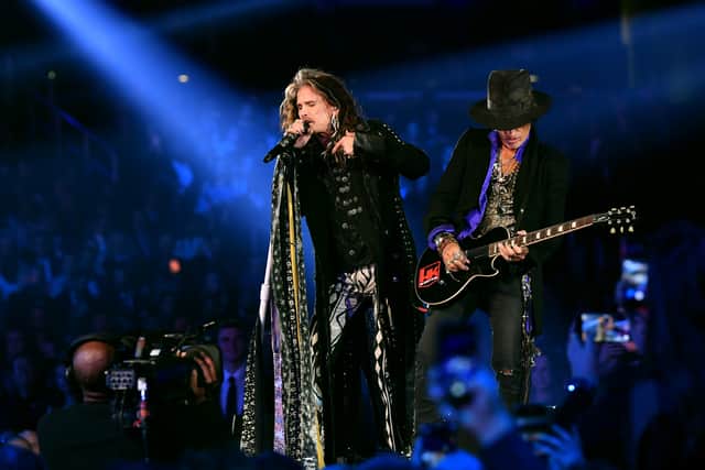 Steven Tyler and Joe Perry perform onstage