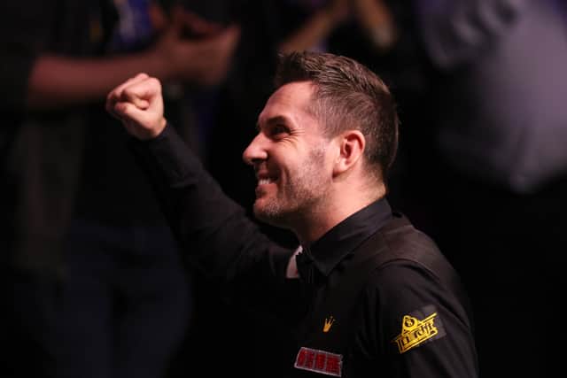 Mark Selby of England celebrates making a maximum 147 break during their Final match against Luca Brecel of Belgium on Day Sixteen of the Cazoo World Snooker Championship 2023 - Credit: Getty