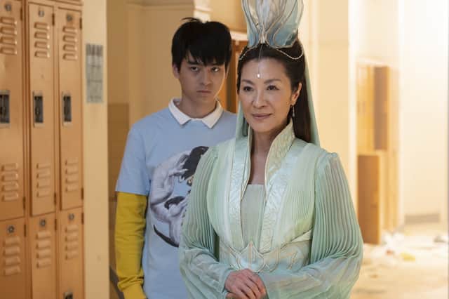 Jimmy Liu as Wei-Chen and Michelle Yeoh as Guanyin in American Born Chinese (Credit: Disney+/Carlos Lopez-Calleja)