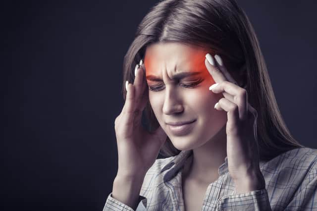 Symptoms of a listeria infection include headache, stiff neck and a loss of balance among other signs. (Credit: Adobe)