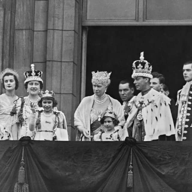The royal couple, with members of the royal family, on the balcony of Buckingham Palace after the coronation of George VI and Elizabeth at Westminster Abbey, London, 12th May 1937 - Credit: Getty Images