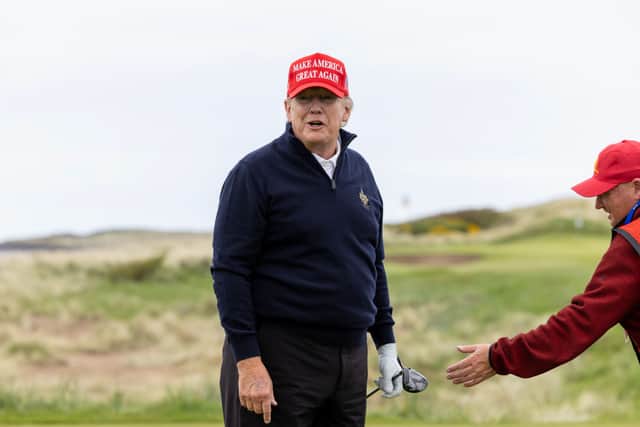 TURNBERRY, SCOTLAND - MAY 02: Former U.S. President Donald Trump reacts during a round of golf at his Turnberry course on May 2, 2023 in Turnberry, Scotland.  Former U.S. President Donald Trump is visiting his golf courses in Scotland and Ireland. Back in the United States, he faces legal action on 34 counts of falsifying business records. (Photo by Robert Perry/Getty Images)
