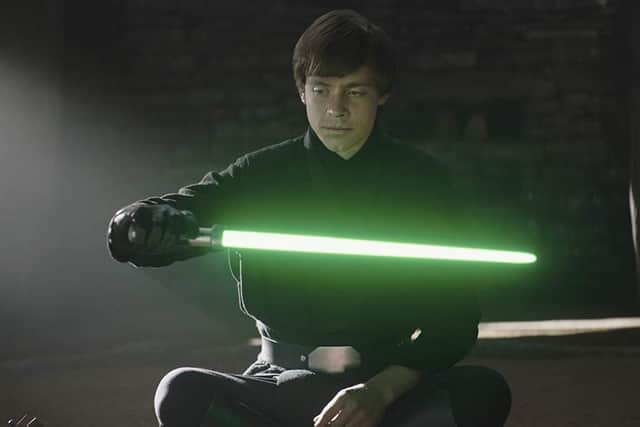 Luke Skywalker adopts Yoda's lightsaber, demonstrating that he has reached a master level of using the force and becoming an ultimate Jedi (Credit: Lucasfilm)