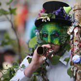 A performer with the Hal-an-Tow pageant blows his horn as part of the Helston Flora Day celebrations of 2013 (Photo: Matt Cardy/Getty Images)