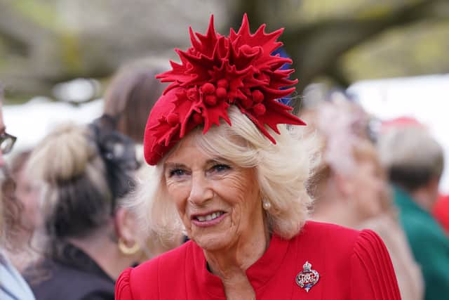 Camilla, The Queen Consort, Colonel, Grenadier Guards is seen meeting guests after a ceremony where King Charles III presented new Standards and Colours to the Royal Navy; the Life Guards of the Household Cavalry Mounted Regiment; The King's Company of the Grenadier Guards, and The King's Colour Squadron of the Royal Air Force, at Buckingham Palace on April 27, 2023 in London, England. (Photo by  Yui Mok - WPA Pool/Getty Images)