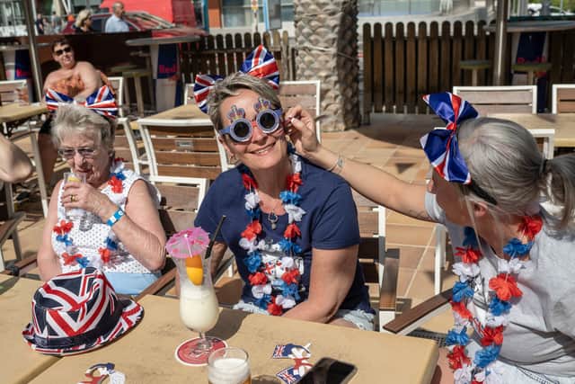 Dress up was encouraged for ex-pats and tourists in Benidorm for the coronation. (Credit: Getty Images)