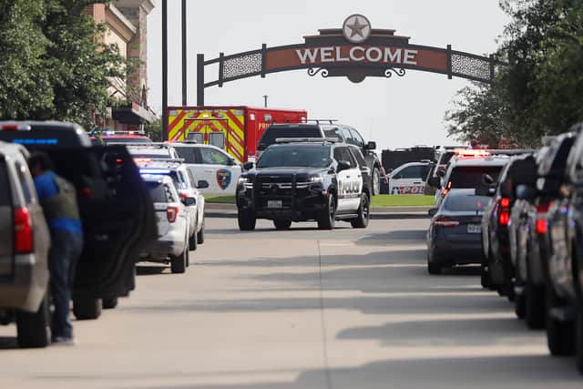 Emergency vehicles line the entrance to the Allen Premium Outlets. Picture: Stewart  F. House/Getty Images