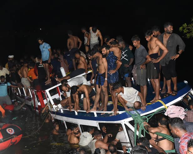 People carry out rescue operation at the site of a boat accident in Tanur, in Malappuram district of India's Kerala state (Image: AFP via Getty Images)