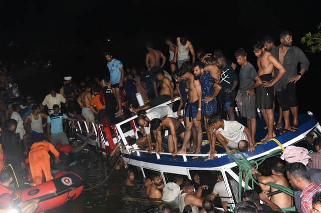 People carry out rescue operation at the site of a boat accident in Tanur, in Malappuram district of India's Kerala state (Image: AFP via Getty Images)