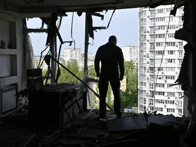 Mayor of Ukrainian capital Vitali Klitschko examines a high-rise residential building damaged by remains of a shot down Russian drone in Kyiv on May 8 (Photo by GENYA SAVILOV/AFP via Getty Images)