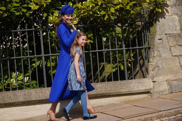 WINDSOR, ENGLAND - APRIL 09: Catherine, Princess of Wales with Princess Charlotte leave after attending the Easter Mattins Service at St George's Chapel at Windsor Castle on April 9, 2023 in Windsor, England. (Photo by Yui Mok - WPA Pool/Getty Images)