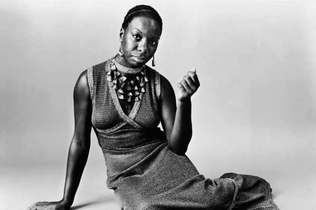 This studio portrait shows American pianist and jazz singer Nina Simone reclining on the floor circa 1968.   (Photo by Getty Images)