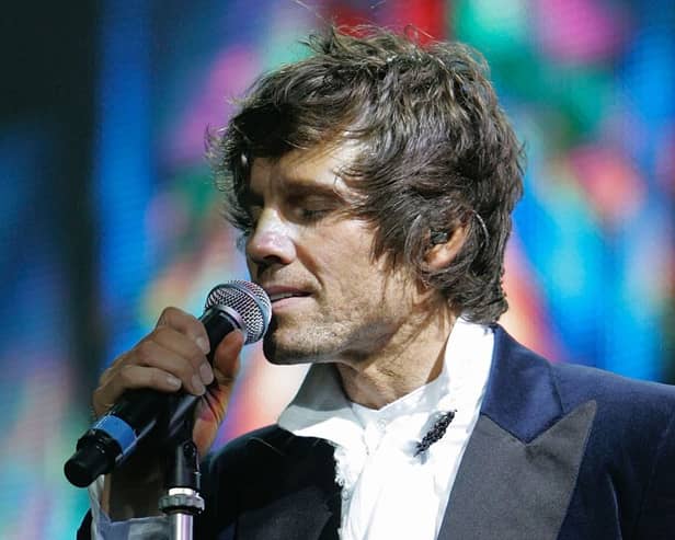 MANCHESTER, UNITED KINGDOM - MAY 04:  Singer Jason Orange of Take That performs onstage as part of the band's Ultimate Tour 2006 at Manchester Arena on May 4, 2006 in Manchester, England. The popular group produced a number of hit singles during the 1990s before Robbie Williams's departure and the band's subsequent split in February 1996.  (Photo by Christopher Furlong/Getty Images)