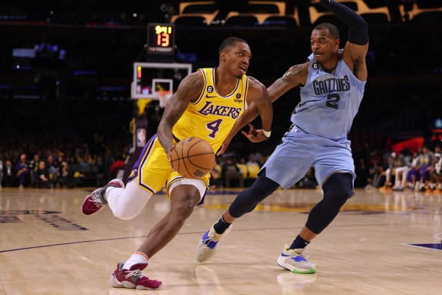 Lonnie Walker IV #4 of the Los Angeles Lakers drives to the basket on Xavier Tillman #2 of the Memphis Grizzlies during the first half at Crypto.com Arena on March 07, 2023 in Los Angeles, California (Photo by Harry How/Getty Images)