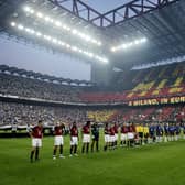 AC and Inter Milan players lining up in the San Siro stadium in 2003 with AC hosting