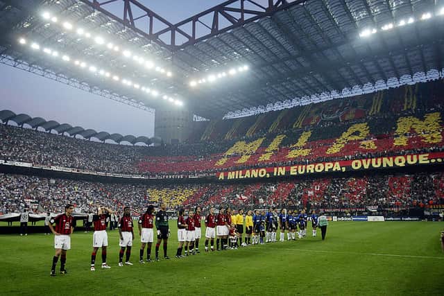 AC and Inter Milan players lining up in the San Siro stadium in 2003 with AC hosting