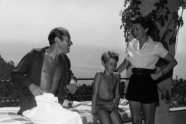 9th September 1952:  British actor Rex Harrison (1908 - 1990) with his wife, actress Lilli Palmer and their son Kerry on the verandah of their villa overlooking the Gulf of Portofino.  (Photo by Keystone Features/Getty Images)