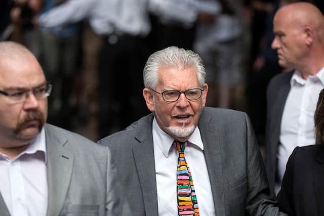 Artist and TV presenter Rolf Harris (centre) arrives at Southwark Crown Court to face sentencing on 12 counts of indecent assault in 2014 in London, England (Photo: Oli Scarff/Getty Images)