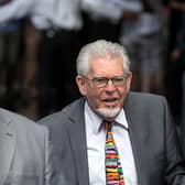 Artist and TV personality Rolf Harris (centre) arrives at Southwark Crown Court to face sentencing on 12 counts of indecent assault in 2014 in London, England (Photo: Oli Scarff/Getty Images)
