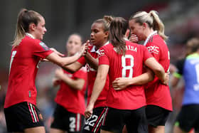 Alessia Russo celebrates scoring against Spurs with Manchester United