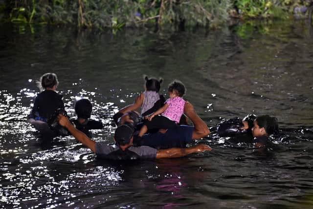 Migrants cross the Rio Grande River as they try to get to the US, from Matamoros, state of Tamaulipas, Mexico, on May 11, 2023. A surge of migrants is expected at the US-Mexico border cities as President Biden administration is officially ending its use of Title 42. Credit: Getty