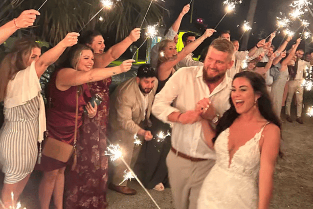 A heartbreaking photo shows the newly-wed couple beaming as they leave their wedding reception, just moments before the tragedy occurred. Credit: GoFundMe 