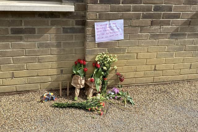 Flowers at the scene on Commercial Road, Limehouse. Picture: SWNS