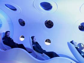 Virgin employees sit in the cabin of a prototype Virgin Galactic SpaceShipTwo spacecraft at the Science Museum (Photo: Daniel Berehulak/Getty Images)