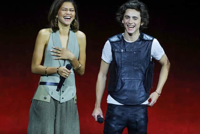 LAS VEGAS, NEVADA - APRIL 25: Zendaya (L) and TimothÃ©e Chalamet laugh onstage as they promote their upcoming film "Dune: Part Two" during the Warner Bros. Pictures Studio presentation during CinemaCon, the official convention of the National Association of Theatre Owners, at The Colosseum at Caesars Palace on April 25, 2023 in Las Vegas, Nevada. (Photo by Ethan Miller/Getty Images)