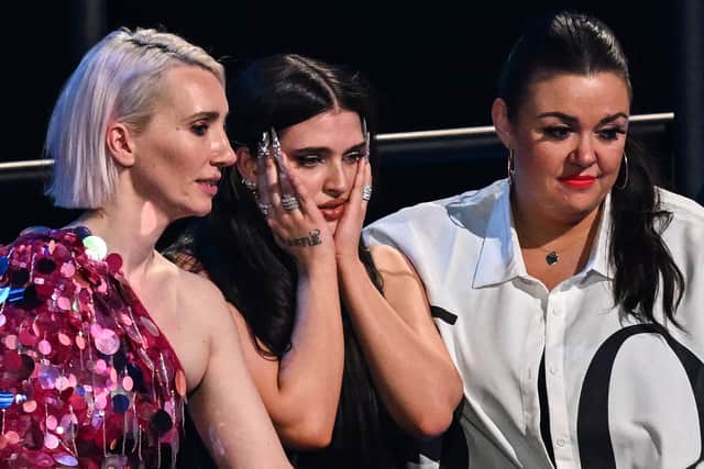 This is not the face you want to see your entry pull during live results - Mae Muller watches on as the UK drops further down the table at Eurovision 2023 (Credit: Getty Imaes)