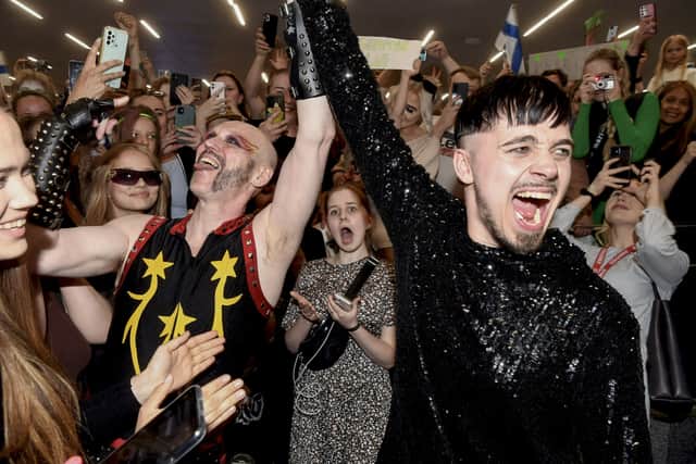 Rapper Kaarija of Finland (R) greets his supporters after arriving from the Eurovision Song Contest 2023 of Liverpool at the Helsinki airport in Vantaa, Finland on May 14, 2023. (Photo by Kimmo Penttinen / Lehtikuva / AFP) / Finland OUT (Photo by KIMMO PENTTINEN/Lehtikuva/AFP via Getty Images)