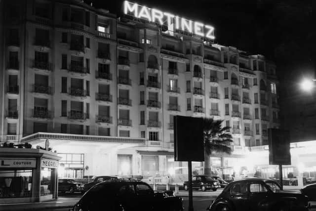 A night view of the Martinez Hotel in Cannes.  (Photo by George W. Hales/Fox Photos/Getty Images)