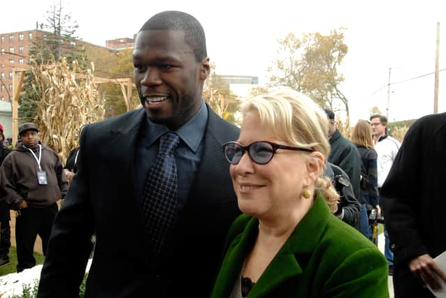 Rap artist/actor Curtis "50 Cent" Jackson and  actress/singer and the founder of NYRP Bette Midler attend the opening celebration for New York Restoration Project's new community garden at 117-19 165th Street on November 3, 2008 in Jamaica, New York.  (Photo by Joe Corrigan/Getty Images)
