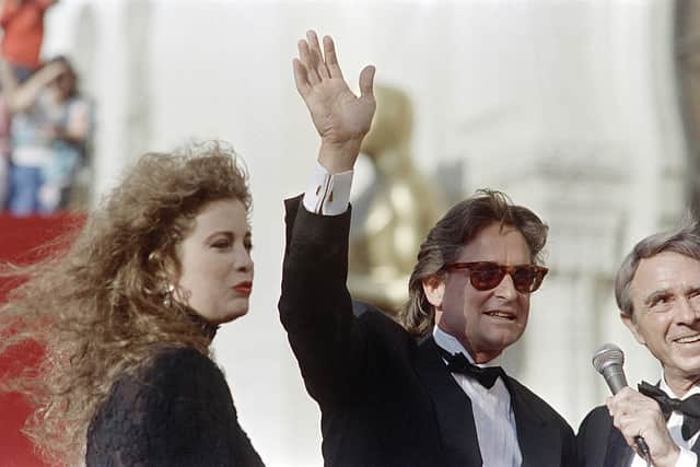 Michael Douglas (C) accompanied by his wife Diandra arrives for the 60th Annual Academy Awards, on April 11, 1988, in Hollywood, California.  (Photo: JOAQUIN VILLEGAS/AFP via Getty Images)