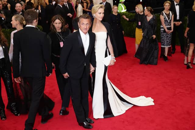 Sean Penn and Charlize Theron attend the "Charles James: Beyond Fashion" Costume Institute Gala at the Metropolitan Museum of Art on May 5, 2014 in New York City.  (Photo by Neilson Barnard/Getty Images)
