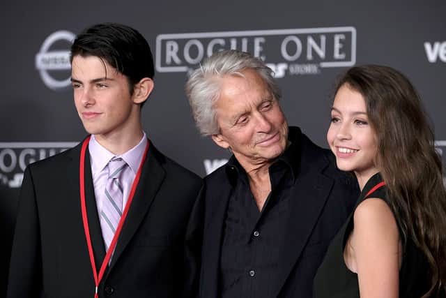 (L-R) Dylan Michael Douglas, Michael Douglas and Carys Zeta-Douglas attend the premiere of Walt Disney Pictures and Lucasfilm's "Rogue One: A Star Wars Story" at the Pantages Theatre on December 10, 2016 in Hollywood, California.  (Photo by Frazer Harrison/Getty Images)