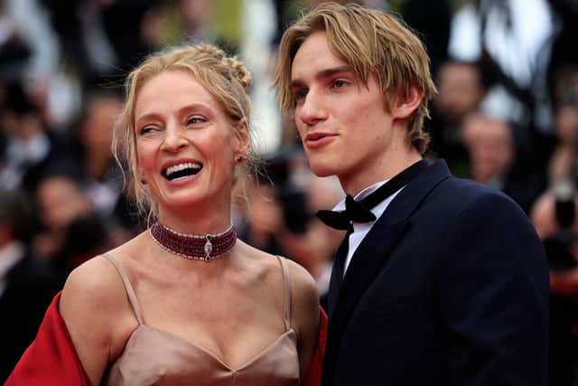 US actress Uma Thurman (L) arrives with her son Levon Roan Thurman-Hawke for the opening ceremony and the screening of the film "Jeanne du Barry" during the 76th edition of the Cannes Film Festival in Cannes, southern France, on May 16, 2023. (Photo by Valery HACHE / AFP) (Photo by VALERY HACHE/AFP via Getty Images)