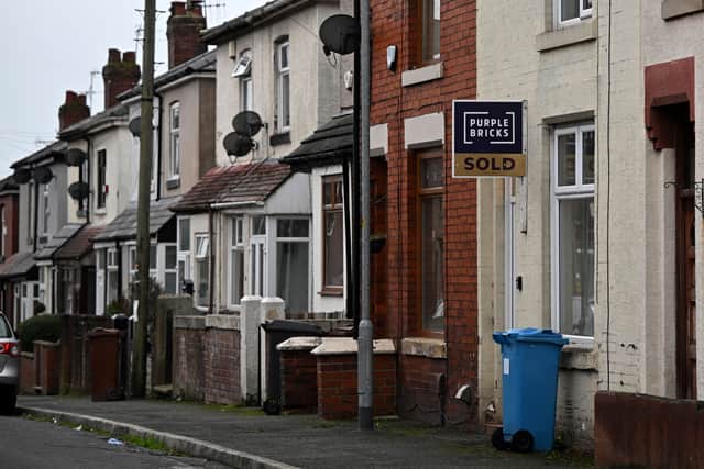 A Purplebricks 'sold' board pictured on a house in a row of terraced homes on a residential street near Oldham in 2022 (Photo: OLI SCARFF/AFP via Getty Images)