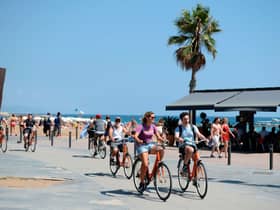 Holidaymakers could be fined for wearing earphones while cycling in Spain (Photo: Getty Images)