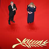 French actress Catherine Deneuve (R) delivers a speech next to US actor and Honorary Palme d'or of the 76th Festival de Cannes Michael Douglas during the opening ceremony of the 76th edition of the Cannes Film Festival in Cannes, southern France, on May 16, 2023. (Photo by Antonin THUILLIER / AFP) (Photo by ANTONIN THUILLIER/AFP via Getty Images)