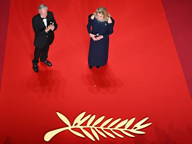 French actress Catherine Deneuve (R) delivers a speech next to US actor and Honorary Palme d'or of the 76th Festival de Cannes Michael Douglas during the opening ceremony of the 76th edition of the Cannes Film Festival in Cannes, southern France, on May 16, 2023. (Photo by Antonin THUILLIER / AFP) (Photo by ANTONIN THUILLIER/AFP via Getty Images)