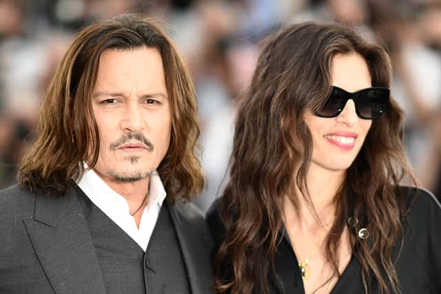 US actor Johnny Depp (L) and French actress and director Maiwenn pose during a photocall for the film "Jeanne Du Barry" at the 76th edition of the Cannes Film Festival in Cannes, southern France, on May 17, 2023. (Photo by CHRISTOPHE SIMON / AFP) (Photo by CHRISTOPHE SIMON/AFP via Getty Images)