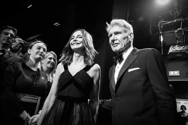 Calista Flockhart and Harrison Ford attend a ceremony as he receives an honorary Palme D'Or during the 76th annual Cannes film festival at Palais des Festivals on May 18, 2023 in Cannes, France. (Photo by Pascal Le Segretain/Getty Images)