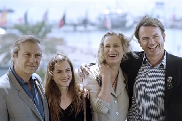 New Zealander film director Jane Campion (L) poses with actors (from L), Harvey Keitel, Holly Hunter and Sam Neill, on May 17, 1993,  during a photocall for the film "The piano" presented in Competition at the 46th edition of the Cannes Film Festival in Cannes. (GERARD JULIEN/AFP via Getty Images)