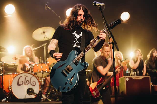 (L-R) Taylor Hawkins, Dave Grohl and Nate Mendel of Foo Fighters performs onstage at the after party for the Los Angeles premiere of "Studio 666" at the Fonda Theatre on February 16, 2022 in Hollywood, California. (Photo by Rich Fury/Getty Images)
