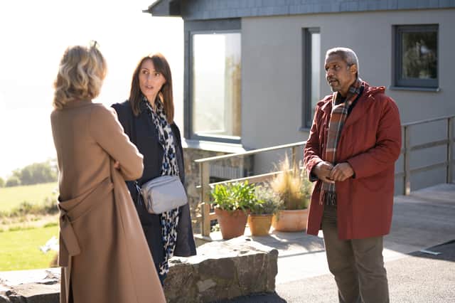 Eve Best as Rosaline, Suranne Jones as Becca, and Hugh Quarshie as Pete in Maryland, stood outside Pete's Isle of Man house (Credit: ITV/Eoin Holland)