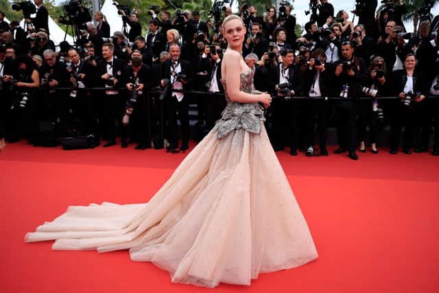US actress Elle Fanning arrives for the opening ceremony and the screening of the film "Jeanne du Barry" during the 76th edition of the Cannes Film Festival in Cannes, southern France, on May 16, 2023. (Photo by Valery HACHE / AFP) (Photo by VALERY HACHE/AFP via Getty Images)