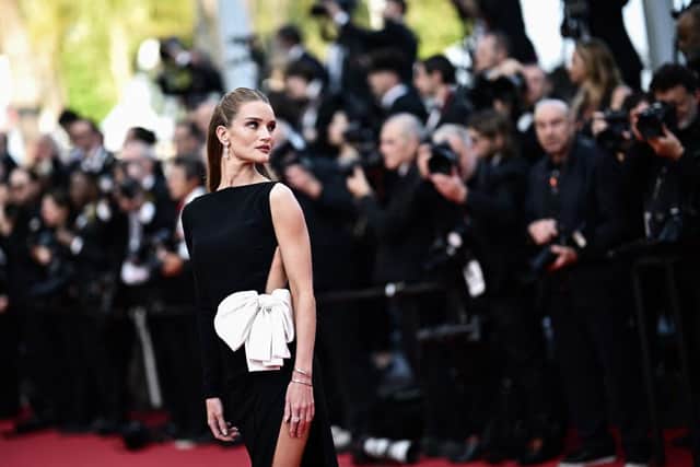 TOPSHOT - British model Rosie Huntington-Whiteley arrives for the screening of the film "Club Zero" during the 76th edition of the Cannes Film Festival in Cannes, southern France, on May 22, 2023. (Photo by LOIC VENANCE / AFP) (Photo by LOIC VENANCE/AFP via Getty Images)