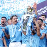 Ilkay Guendogan lifts the Premier League trophy with Man City after win over Chelsea